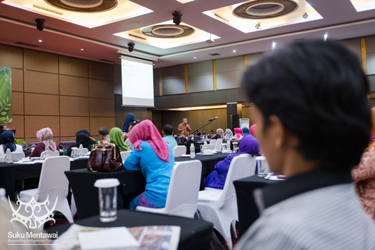 Suku Mentawai director, Esmat Sakulok, listening to Dr. Bambang Rudito speak about Mentawai culture