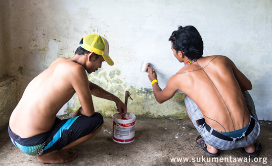 Yayasan PGPI Director and Manager giving the proposed office space a coat of paint