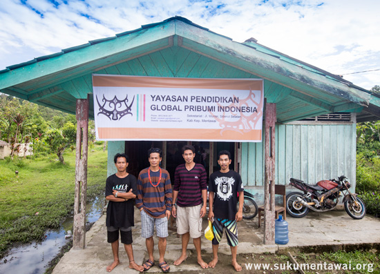 Yayasan PGPI standing in front of their Foundation's banner