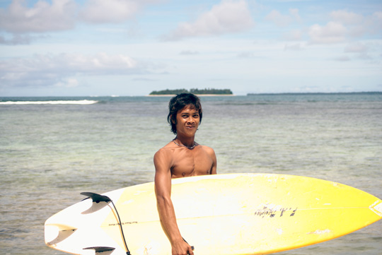 Young Mentawai surfer looking stoked